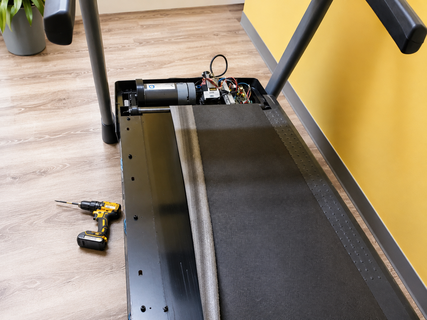 Onsite Fitness technician servicing treadmill equipment
